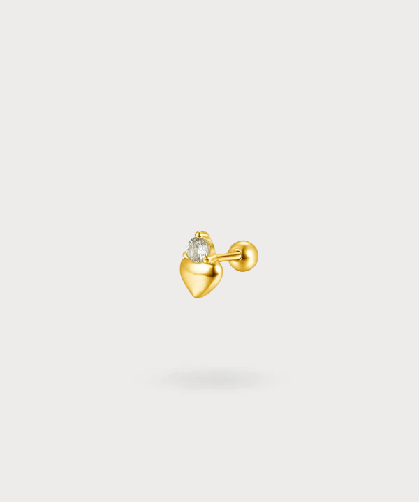 Maya flat piercing in de vorm van een hart met een schitterende zirkonia in goud, een uniek en delicaat sieraad.