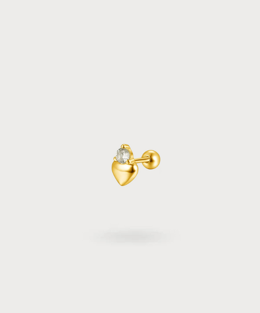Maya flat piercing in de vorm van een hart met een schitterende zirkonia in goud, een uniek en delicaat sieraad.


